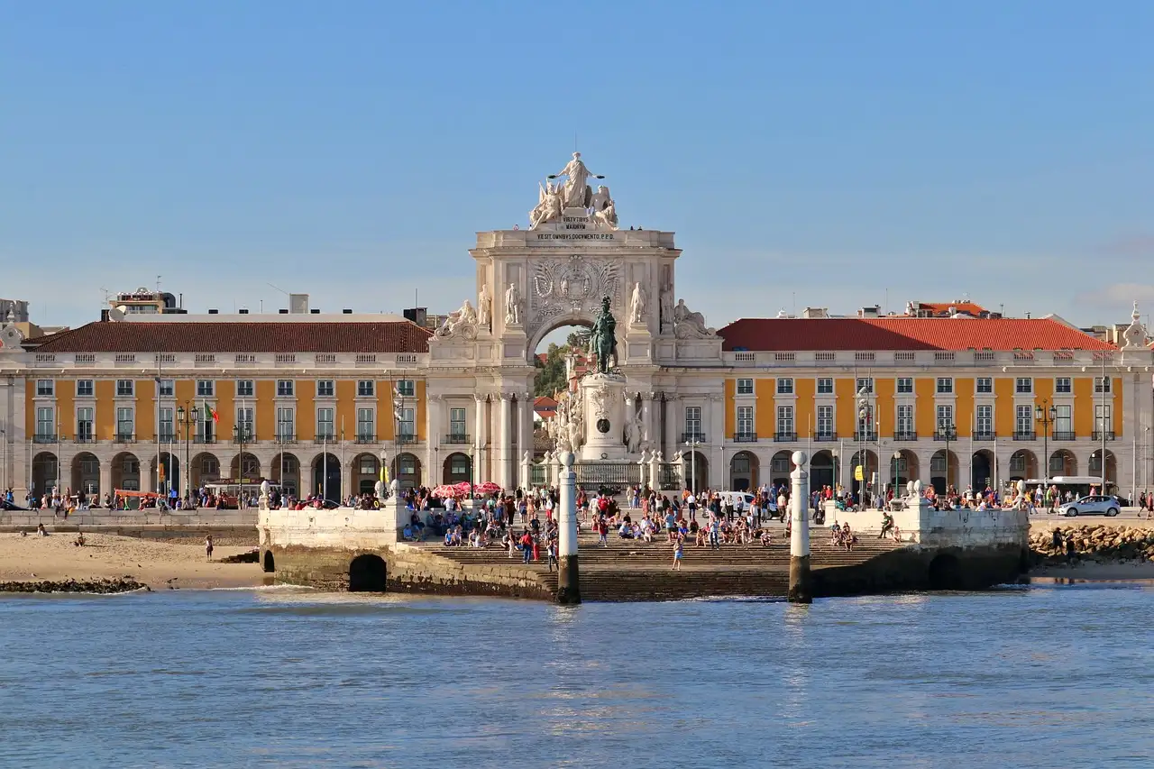 Praça do Comércio in Lisbon with the Rua Augusta Arch and yellow arcades, seen from the river