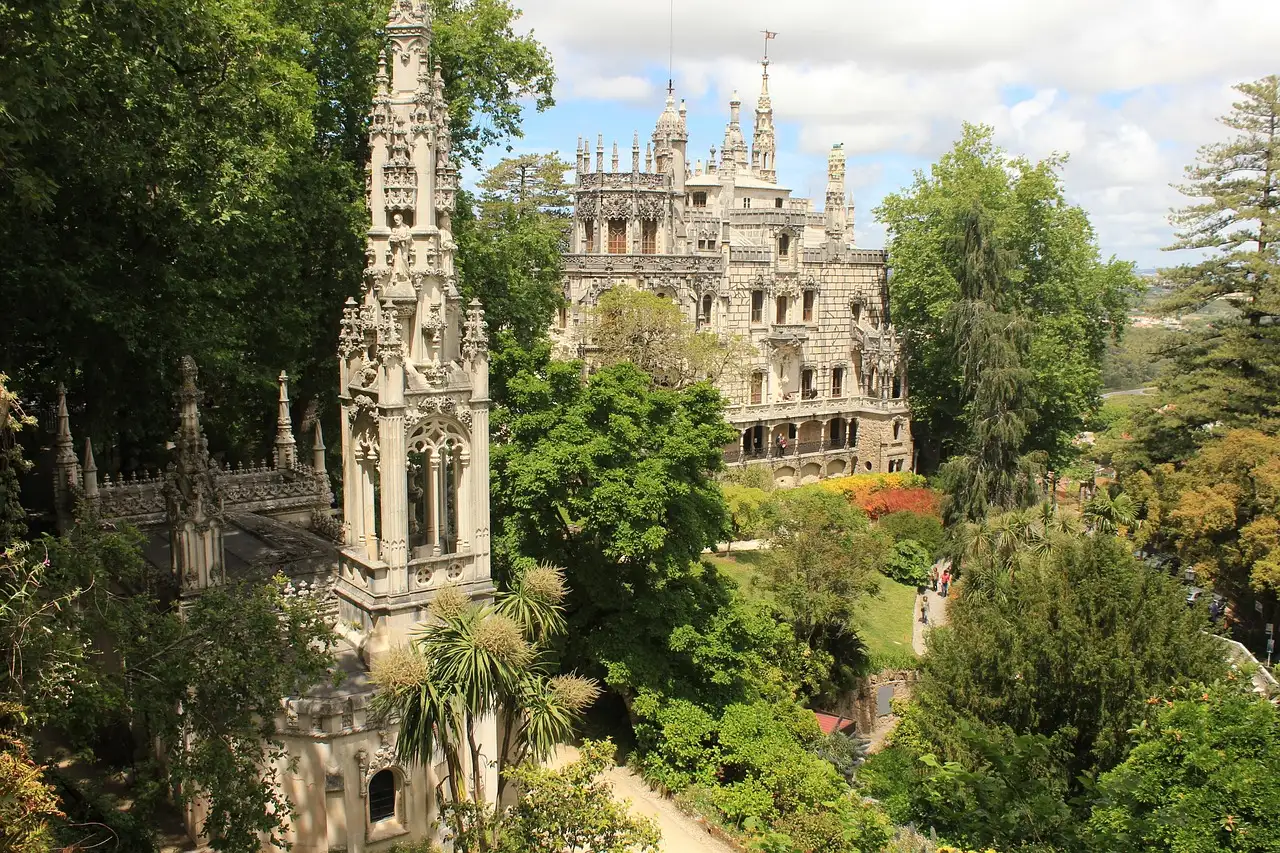 Quinta da Regaleira's Gothic palace and tower among the green gardens of Sintra